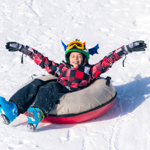 Kid Snow Tubing in Winter